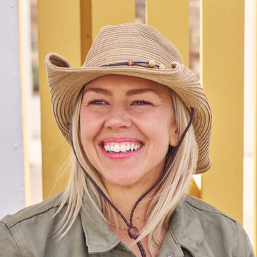 Woman wearing a Sunday Afternoons Sunset Hat.